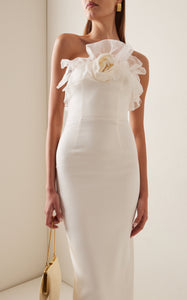 Crafted from a luxurious linen and silk blend, this midi dress features a fitted, boned bodice that shapes your silhouette beautifully. The flowing skirt moves gracefully with every step, while sparkling crystal embellishments catch the light to add an elegant shimmer. Perfect for making a lasting impression, this floral-print dress combines comfort with sophisticated style.