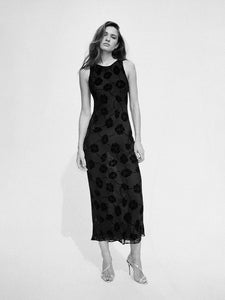 Chic and understated with the right amount of detail. The sheer top layer with tonal velvet flowers dotted all over creates the perfect floral for all you minimal Dreamgirls. The Carla with her boat neck and ankle length, is the silk dress you'll be reaching for...whether it's your day as the low key bride, as that woman all in black at the theatre with a dinner jacket and the perfect earrings, or simply as the Dreamgirl having lunch turning heads in either the ivory or black version.