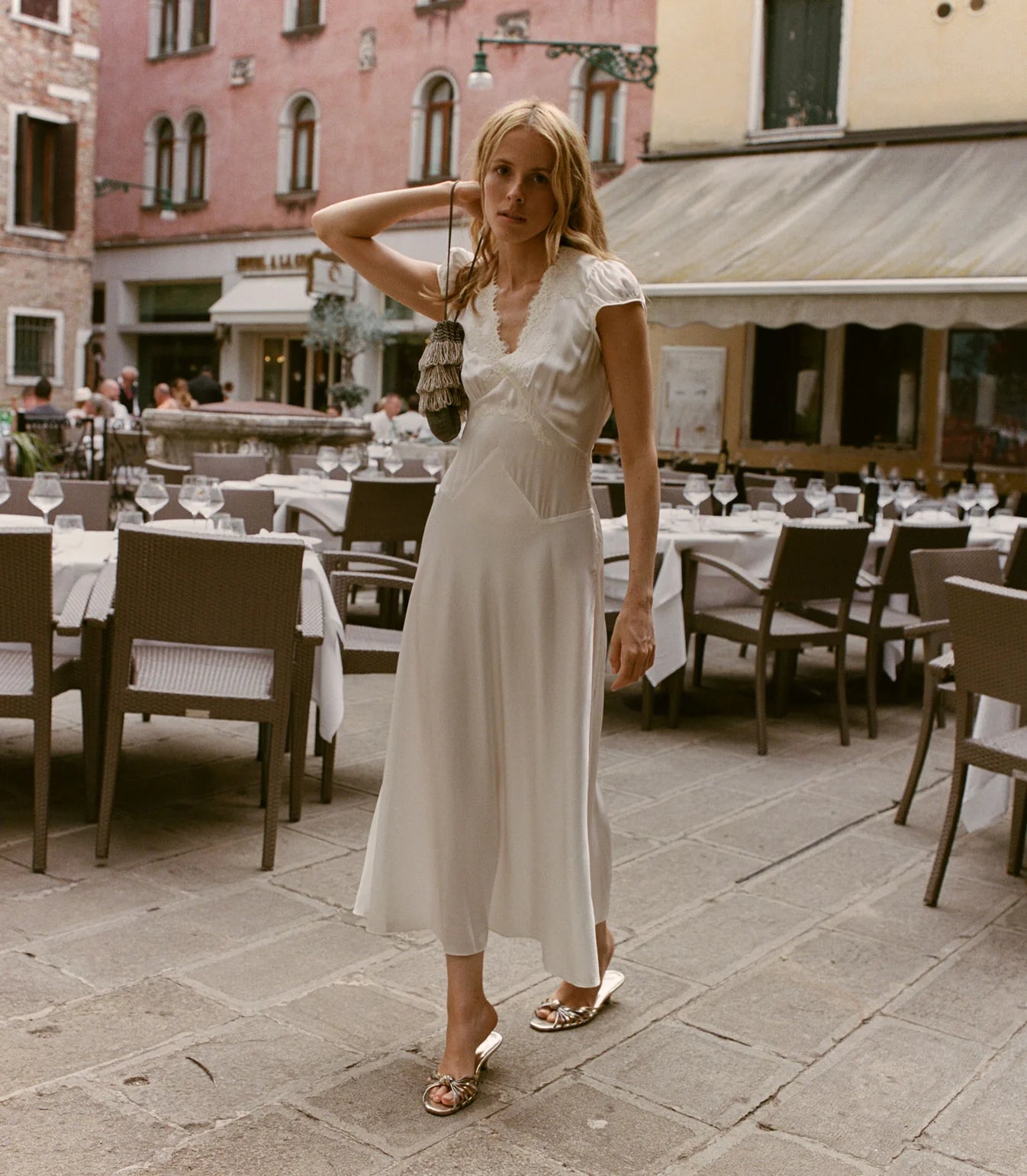 Slip into timeless elegance with the Coraline Dress by Doen, a 1930s-inspired masterpiece crafted from luxurious buttery silk satin. Gathered cap sleeves and a daring plunging V-neckline frame your silhouette, while intricate embroidered scallop lace adds vintage glamour. The fitted bodice features an invisible side seam zipper for seamless styling, paired with an adjustable back waist tie for a personalized fit. 