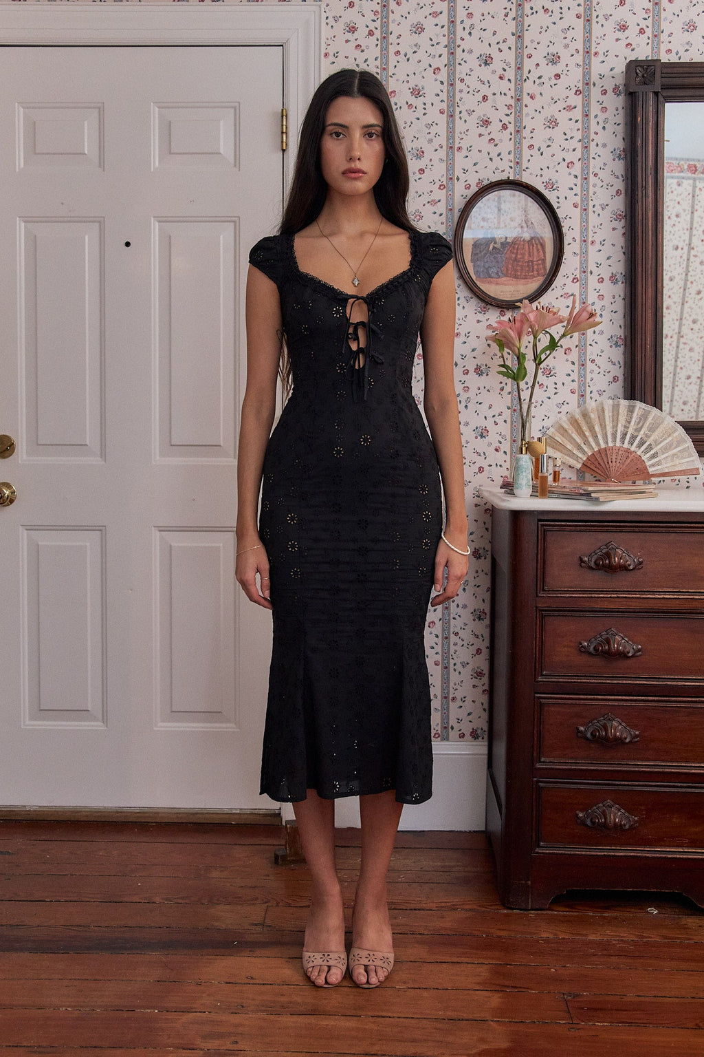 Introducing the Maria Therese Lady Length dress - the perfect combination of elegance and comfort! Made with high-quality cotton and adorned with intricate eyelet and ladder lace trim, this midi dress features silk charmeuse ties for a touch of luxury. The side seam slits and invisible zipper offer both style and functionality. Elevate your wardrobe with this must-have piece.