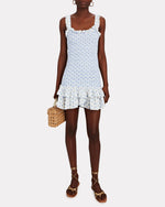 Load image into Gallery viewer, Dare to be bold and romantic in the Breyer Mini Dress by Loveshackfancy! With a delicately printed rosebud pattern, this dress boasts a flattering silhouette with a ruffle-trimmed square neckline and a fitted, smocked bodice. The whimsical ruffle-trimmed straps and layered hem will add a touch of adventure to your wardrobe.
