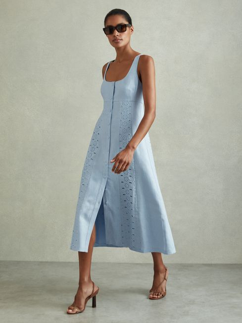 Indulge in summer luxury with the Clarice linen midi dress. This exquisite garment features intricate broderie detailing along the empire waistband and hem, while adjustable shoulder straps and a button-front closure allow for a customizable fit and flow. Made of 100% linen with a cotton lining, it's the perfect combination of elegance and comfort.