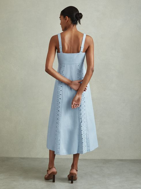 Indulge in summer luxury with the Clarice linen midi dress. This exquisite garment features intricate broderie detailing along the empire waistband and hem, while adjustable shoulder straps and a button-front closure allow for a customizable fit and flow. Made of 100% linen with a cotton lining, it's the perfect combination of elegance and comfort.