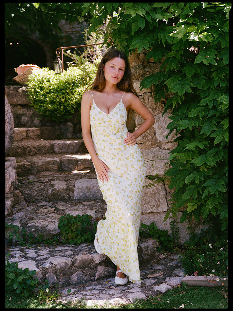 Indulge in the ethereal elegance of the Eugenie Dress in Lemon. The V-neck and soft lemon print portray a romantic and feminine vibe. Perfect for a holiday lunch or a sensual evening out, this dress will elevate your style with its delicate, yet chic design. Pair with Mary Janes or strappy sandals for a luxurious look.