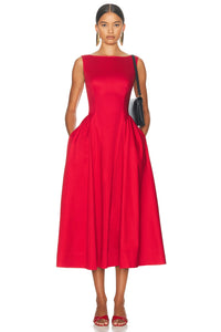 Indulge in the luxe feel of this Sateen Midi Dress. The sleek and silky fabric will elevate your style while the hidden back zipper closure provides a seamless silhouette. With side slip pockets and an unlined design, this dress offers both convenience and sophistication. Dry clean only for lasting quality.