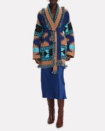 Load image into Gallery viewer, Indulge in the elegance of Alanui&#39;s Icon Cashmere-Wool Wrap Cardigan. Crafted from plush cashmere-wool jacquard, this luxurious boho staple features a shawl collar, fringe trim, and geometric motifs. With convenient side slash pockets and an optional sash tie belt, it&#39;s the epitome of sophisticated style.
