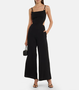 The Combinaison Mabel is an elegant and versatile jumpsuit from the SIMKHAI collection. Made with high-quality cotton, it features a unique Mabel cutout design that adds a touch of sophistication. Perfect for any occasion, this jumpsuit will make you look and feel stylish and confident.