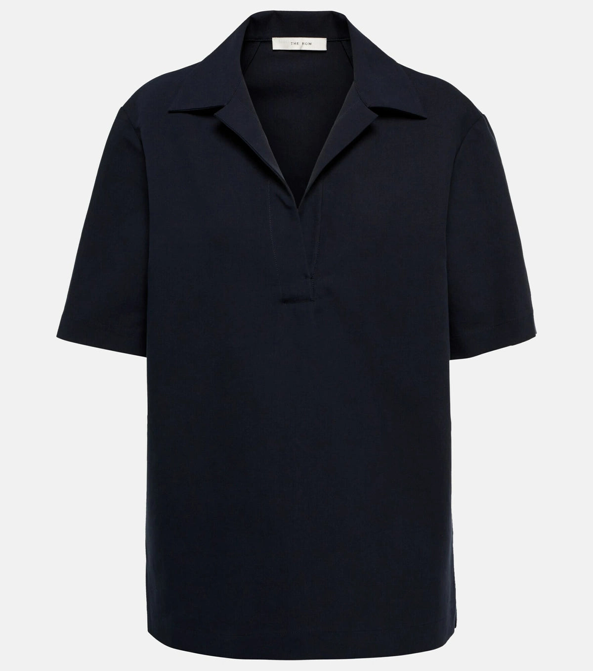 Experience effortless elegance with the Bernardine cotton shirt by The Row, meticulously crafted from pure, finely woven cotton. Featuring a spread collar and an open partial placket, this shirt offers a breezy fit that's perfect for warm weather. Its understated design reflects The Row's commitment to quality and timeless style, making it a versatile addition to your summer wardrobe.
