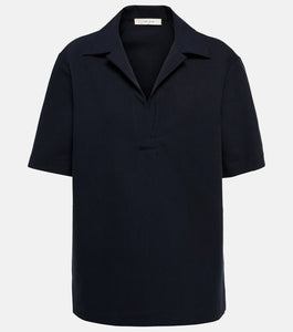 Experience effortless elegance with the Bernardine cotton shirt by The Row, meticulously crafted from pure, finely woven cotton. Featuring a spread collar and an open partial placket, this shirt offers a breezy fit that's perfect for warm weather. Its understated design reflects The Row's commitment to quality and timeless style, making it a versatile addition to your summer wardrobe.