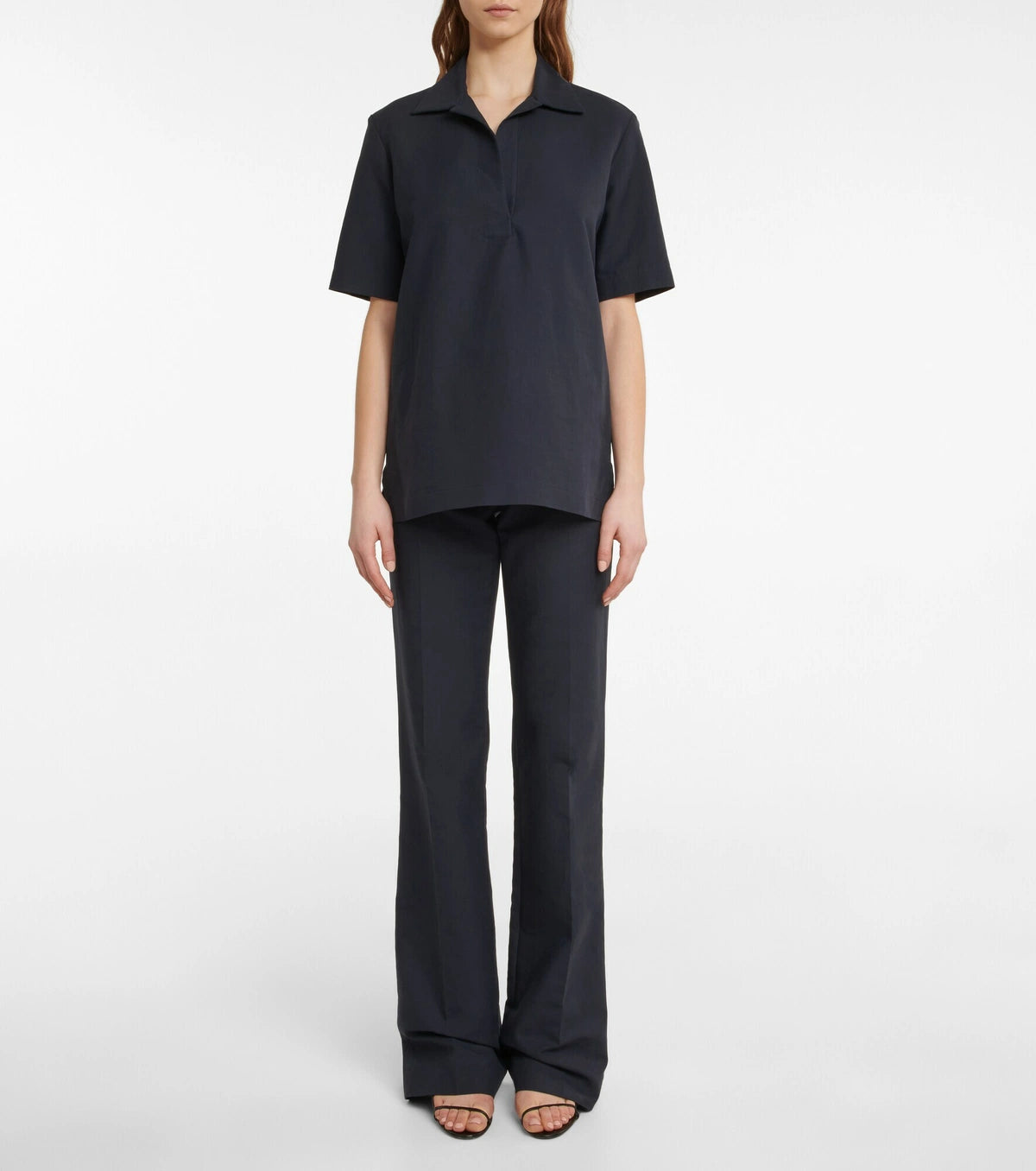Experience effortless elegance with the Bernardine cotton shirt by The Row, meticulously crafted from pure, finely woven cotton. Featuring a spread collar and an open partial placket, this shirt offers a breezy fit that's perfect for warm weather. Its understated design reflects The Row's commitment to quality and timeless style, making it a versatile addition to your summer wardrobe.