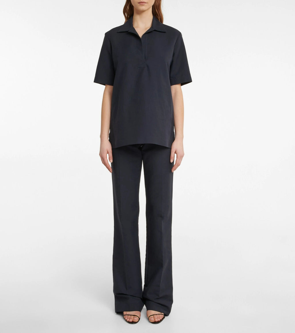 Experience effortless elegance with the Bernardine cotton shirt by The Row, meticulously crafted from pure, finely woven cotton. Featuring a spread collar and an open partial placket, this shirt offers a breezy fit that's perfect for warm weather. Its understated design reflects The Row's commitment to quality and timeless style, making it a versatile addition to your summer wardrobe.