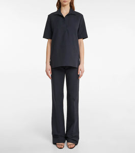Experience effortless elegance with the Bernardine cotton shirt by The Row, meticulously crafted from pure, finely woven cotton. Featuring a spread collar and an open partial placket, this shirt offers a breezy fit that's perfect for warm weather. Its understated design reflects The Row's commitment to quality and timeless style, making it a versatile addition to your summer wardrobe.