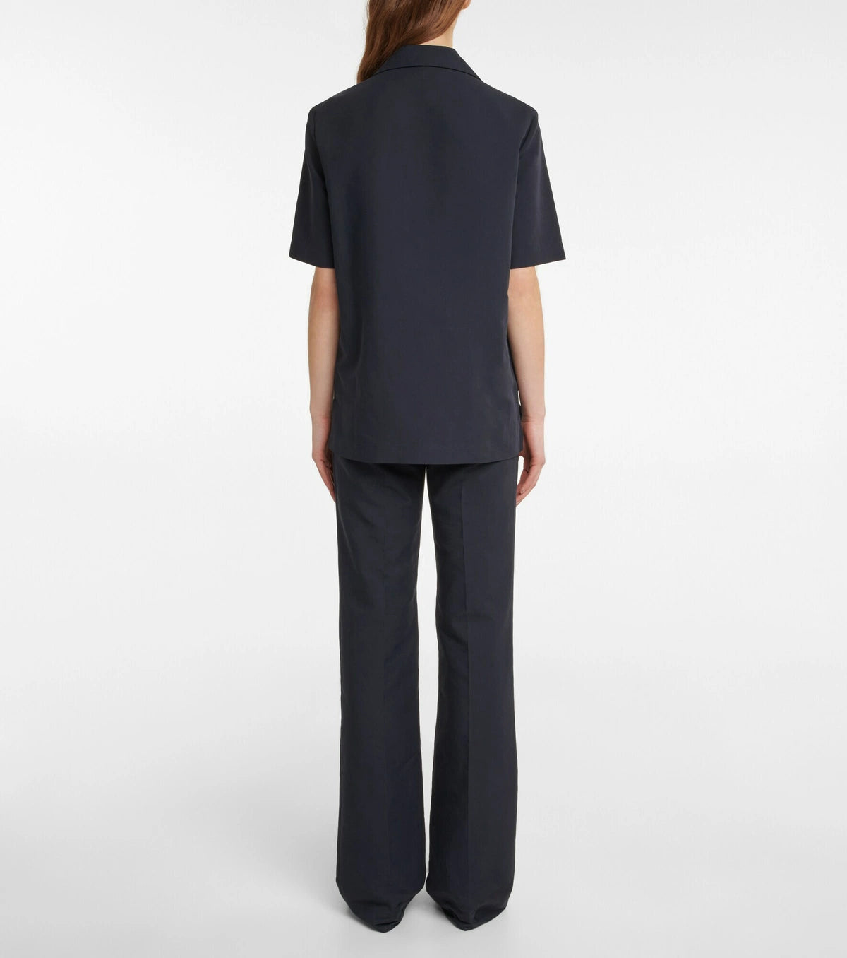 Experience effortless elegance with the Bernardine cotton shirt by The Row, meticulously crafted from pure, finely woven cotton. Featuring a spread collar and an open partial placket, this shirt offers a breezy fit that's perfect for warm weather. Its understated design reflects The Row's commitment to quality and timeless style, making it a versatile addition to your summer wardrobe.