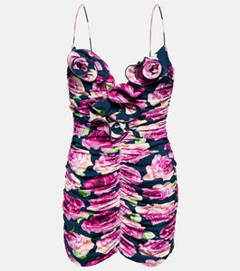 Indulge in pure femininity with Magda Butrym's Floral Ruched Minidress. This exquisite piece boasts a body-hugging silhouette with an all-over ruched texture that adds depth and dimension. Signature rosettes on the bust elevate the playful proportions of this luxurious minidress. Elevate your wardrobe with this sophisticated and exclusive piece.