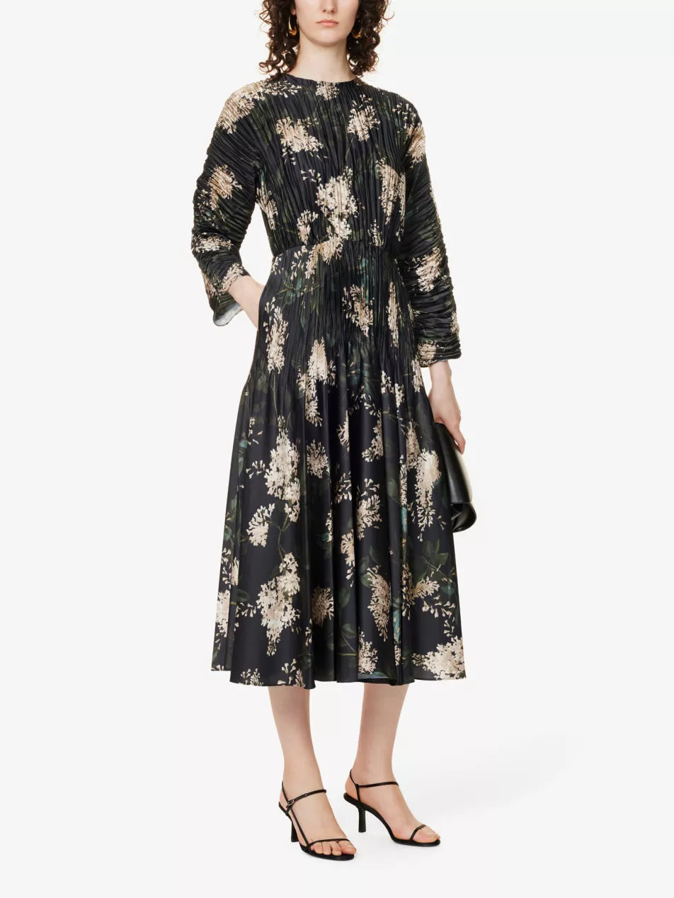 Indulge in fashion and elegance with our Floral-print Pleated Satin Midi Dress. This pleated long dress features a high waist and stunning floral printing, making it a must-have for any fashion-forward individual. Elevate your style with this chic and versatile midi dress!