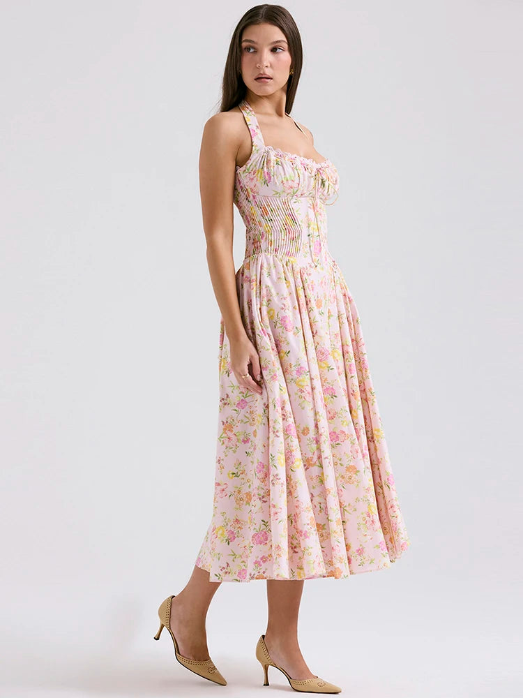 Adabella midi sundress is printed with colourful meadow flowers in full bloom that has us dreaming of Spring sunshine and balmy Summer days. Cut from a stretch cotton-rich fabric, it has a prettily gathered bustier neckline with wide self tie halter straps and a flattering fitted bodice. The voluminous midi skirt has a gorgeous floaty feel that's filled with soft tulle to hold the feminine shape beautifully. It zips to the back for easy on and is of course fully lined for comfort.