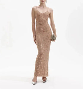 This stunning GOLD SQUARE RHINESTONE MESH MAXI DRESS features a sparkling mesh material adorned with intricate square rhinestones, making it the perfect dress for any glamorous occasion. Stand out while feeling luxurious and elegant in this exquisite and eye-catching dress.