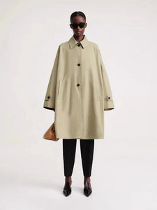 Elevate your spring style with the Trench-coat Elise. This early spring new arrival features an A-line design in a beautiful cashew color, perfect for any occasion. The removable lined interior keeps you warm and comfortable, while the toteme detailing adds a touch of elegance. Upgrade your wardrobe with this must-have piece.