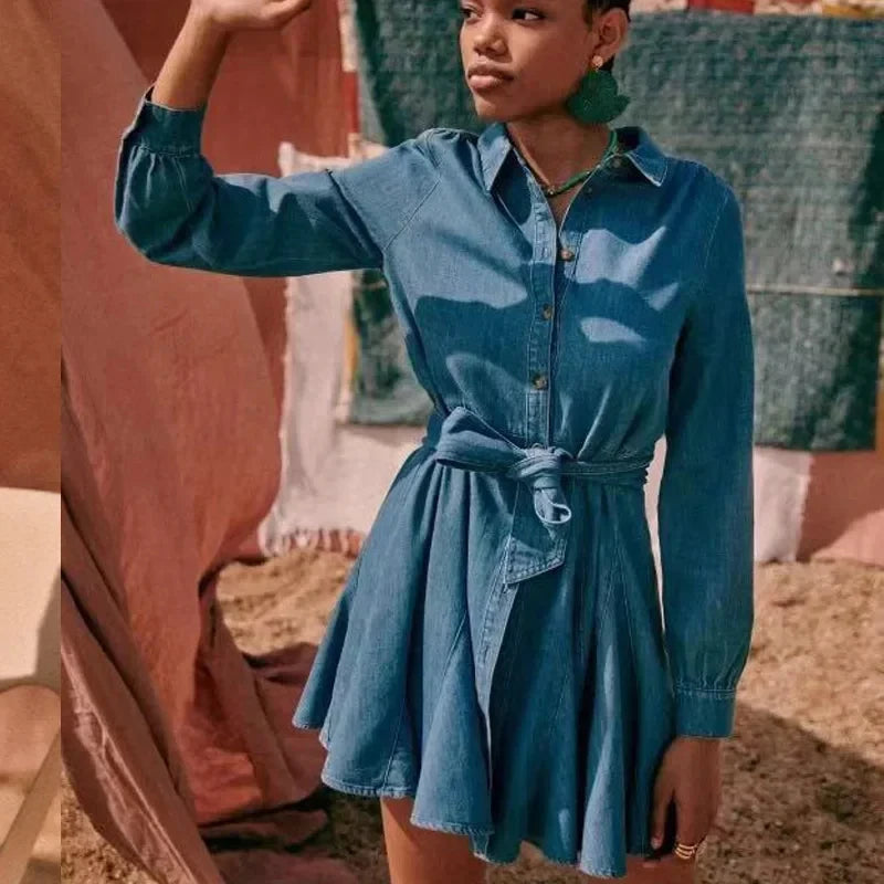 Add a touch of retro charm to your wardrobe with Dress Marie. This casual denim dress features a flattering bow belt that cinches at the waist, creating a feminine silhouette. Perfect for any occasion, this versatile dress will effortlessly elevate your style and make you stand out in a crowd.