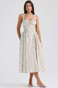 Adabella midi sundress is printed with colourful meadow flowers in full bloom that has us dreaming of Spring sunshine and balmy Summer days. Cut from a stretch cotton-rich fabric, it has a prettily gathered bustier neckline with wide self tie halter straps and a flattering fitted bodice. The voluminous midi skirt has a gorgeous floaty feel that's filled with soft tulle to hold the feminine shape beautifully. It zips to the back for easy on and is of course fully lined for comfort.