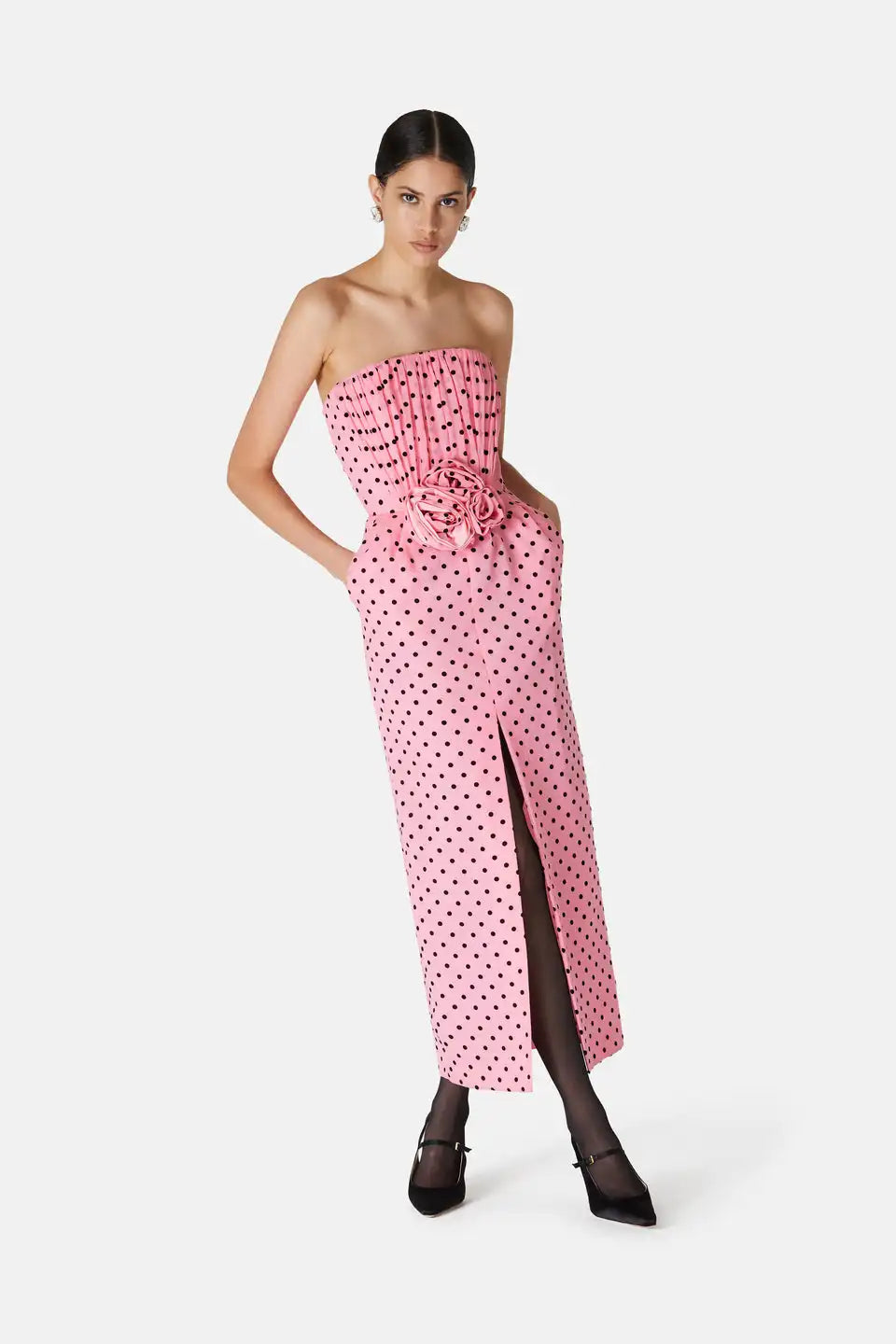 Introducing the Flocked Polka Dot Silk Georgette Dress by Alessandra Rich. Made with luxurious silk georgette fabric and adorned with delicate flocked polka dots, this dress exudes elegance and sophistication. Perfect for any special occasion, this dress is a must-have for any fashion-forward individual looking to make a statement.