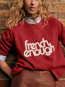 Stay comfy and stylish with this long-sleeved organic cotton sweatshirt. Show off your love for French culture with the "French Enough" print on the front, while staying cozy with the round neckline. Good for you and the environment.