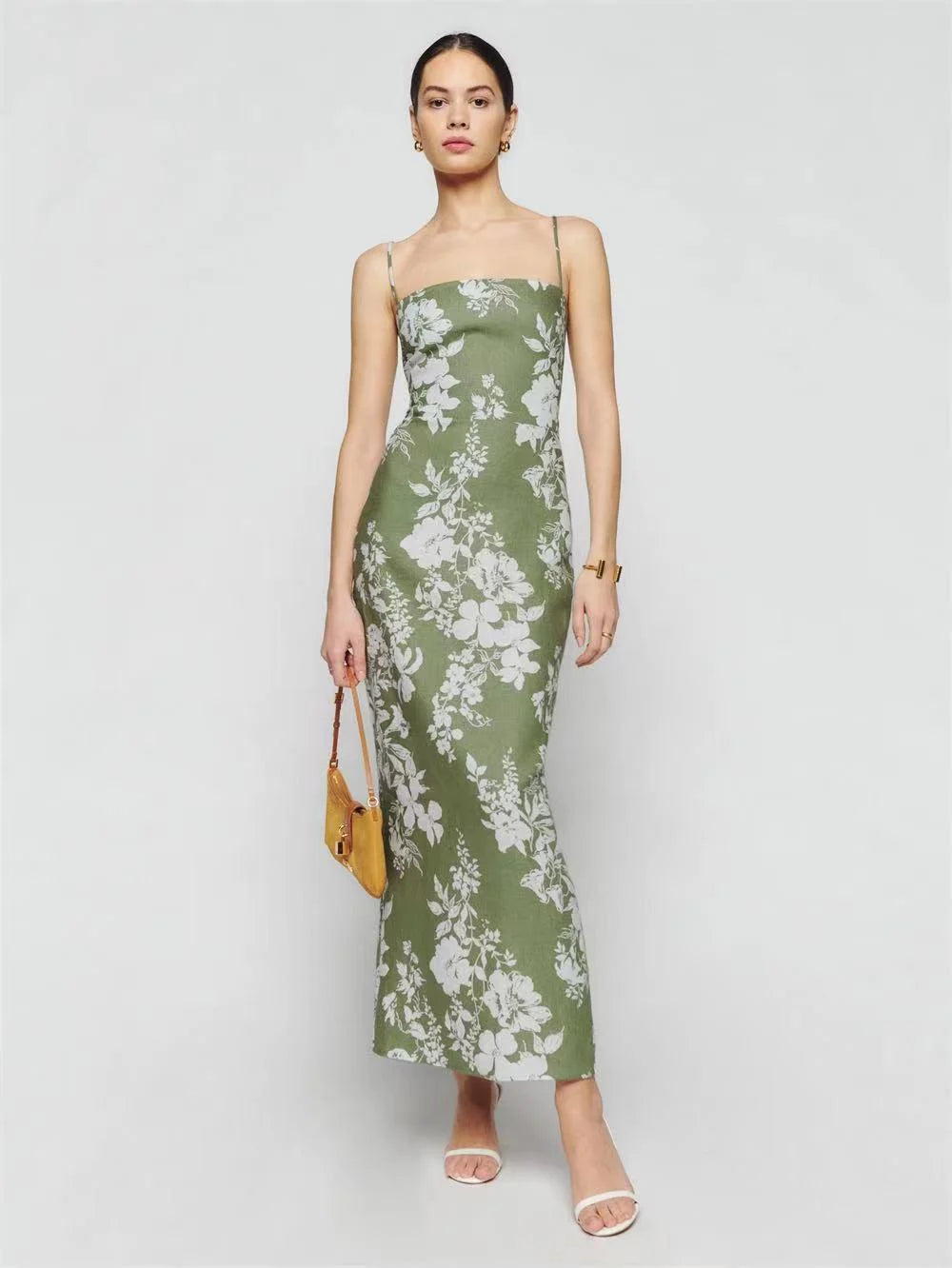 Unleash your inner goddess with our Parma Floral Slip Maxi Dress! Made with vintage linen, this dress offers a sexy strapless design and features a stunning floral print that will make you stand out in any crowd. Its slim fit will accentuate your natural curves, making you feel confident and beautiful. Elevate your style with this elegant and feminine maxi dress.