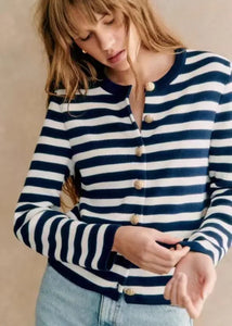 Introducing our Cardigan Baptiste, a must-have for your early spring wardrobe. Perfect for adding a touch of sophistication to any outfit, this versatile and stylish cardigan features a new navy striped design and a button placket for a flattering fit. Made with soft knitted material, it's perfect for all-day comfort. Elevate your style with this long-sleeved women's cardigan.