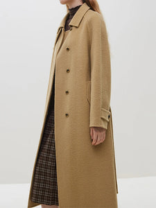 Add a touch of elegance to your wardrobe with Manteaux Victoria. This double breasted woolen jacket features a stand collar design and is made from high-quality wool for a luxurious feel. Perfect for the office or a night out, this solid coat in mocha brown exudes sophistication and style.