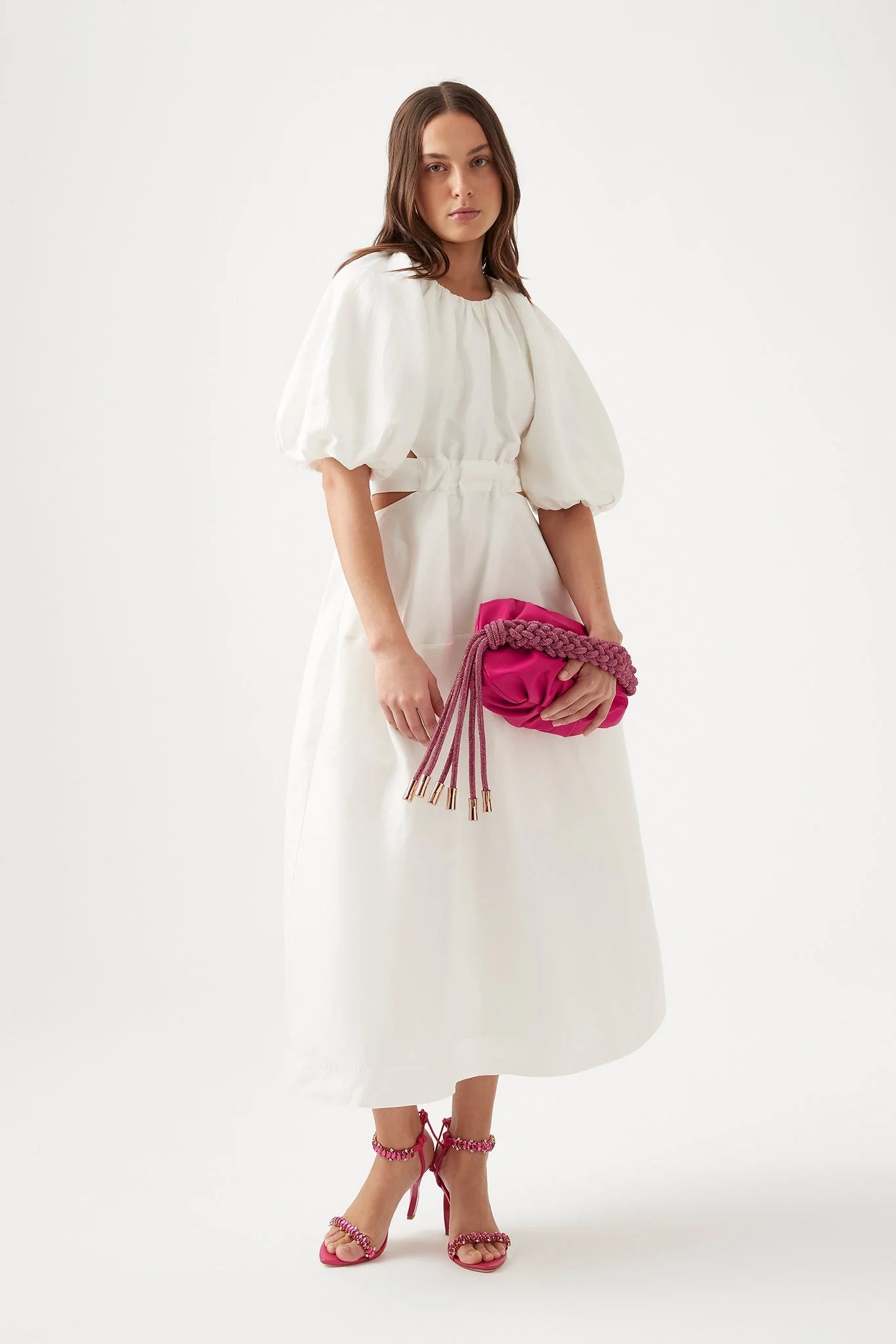 It's hard to resist the charm of Aje's 'Mimosa' dress silhouette. Made from a lightweight linen blend with a cotton lining for added opacity, the dress includes puffed sleeves, a fitted bodice, and waist cutouts. Easily pair it with mules or strappy sandals for a stylish look.