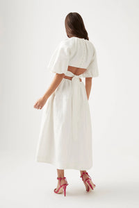 It's hard to resist the charm of Aje's 'Mimosa' dress silhouette. Made from a lightweight linen blend with a cotton lining for added opacity, the dress includes puffed sleeves, a fitted bodice, and waist cutouts. Easily pair it with mules or strappy sandals for a stylish look.