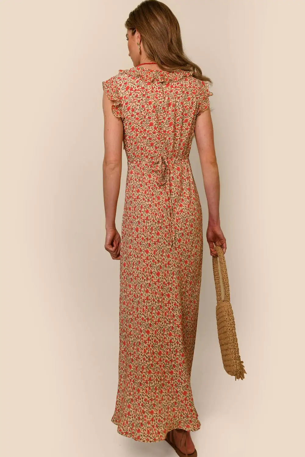 Indulge in the elegance of the Ditsy Cream Dress by RIXO. This high-quality, designer handmade dress features a ditsy cream print and a long, flowing skirt for a chic and sophisticated look. Every thread has been carefully crafted to ensure the utmost quality, making this dress a must-have for any fashion-forward individual.