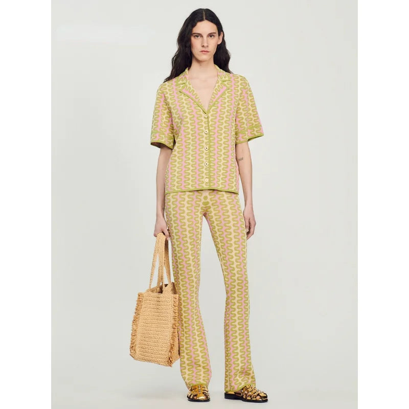 Introducing Ensemble Pauline - the top choice for fashion-forward women this spring. Made with high-quality materials, this French lapel striped shirt and short sleeve knit set exudes both style and comfort. Upgrade your wardrobe with this must-have ensemble, perfect for any occasion.