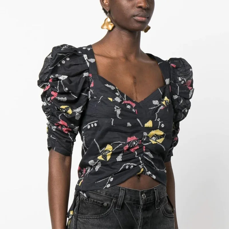 Elevate your wardrobe with the Isabel Marant Étoile Floral-Printed Top. Featuring a beautiful floral print, this top is both feminine and chic. Made with quality materials, it is comfortable and versatile for any occasion. Add a touch of elegance to your look with this must-have piece.