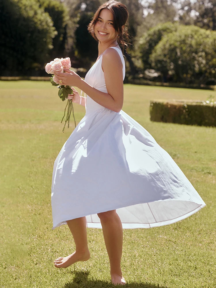 Channeling understated elegance, 'Emmelina' is an effortless wear-anywhere style in a crisp white hue. Beautifully cut from stretch cotton-rich fabric with a gathered bust, it has a plunge neckline that perfectly mirrors the open back and the bodice is corseted to cinch the waist. The floaty midi skirt swishes with every step, adding that ultra feminine feel and it zips to the back for easy on. 'Emmelina' will be your go-to dress as the seasons change.