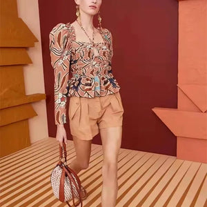 Introducing Blouse Anne, a stunning addition to your wardrobe. Designed by Ulla Johnson, the Mirelle Passion Flower Print brings a touch of elegance to any outfit. With a beautiful copper color, this blouse is perfect for any occasion and will make you feel confident and chic.