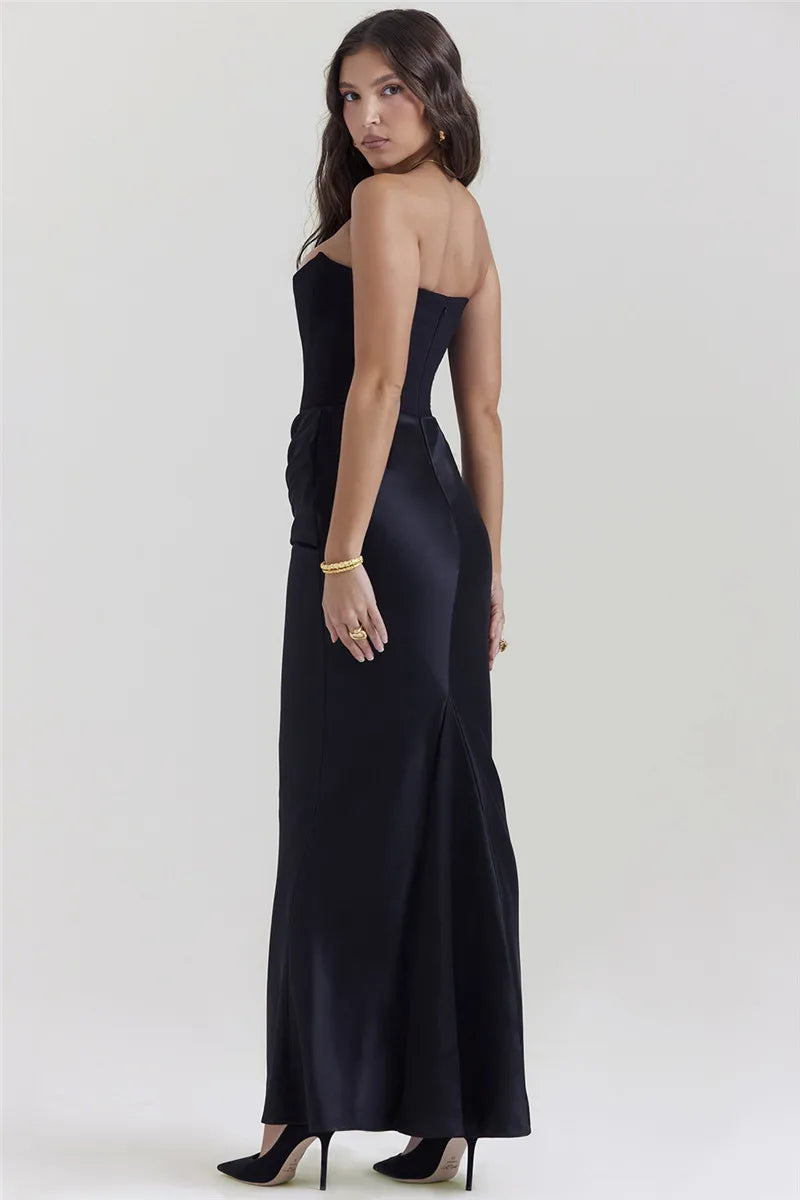 Dress Persephone is a stunning choice for any elegant occasion. With a strapless and bodycon design, this dress exudes confidence and sexiness. This black maxi dress is sure to make a statement and leave a lasting impression. Elevate your style with Persephone!