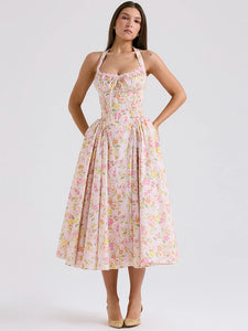 Adabella midi sundress is printed with colourful meadow flowers in full bloom that has us dreaming of Spring sunshine and balmy Summer days. Cut from a stretch cotton-rich fabric, it has a prettily gathered bustier neckline with wide self tie halter straps and a flattering fitted bodice. The voluminous midi skirt has a gorgeous floaty feel that's filled with soft tulle to hold the feminine shape beautifully. It zips to the back for easy on and is of course fully lined for comfort.