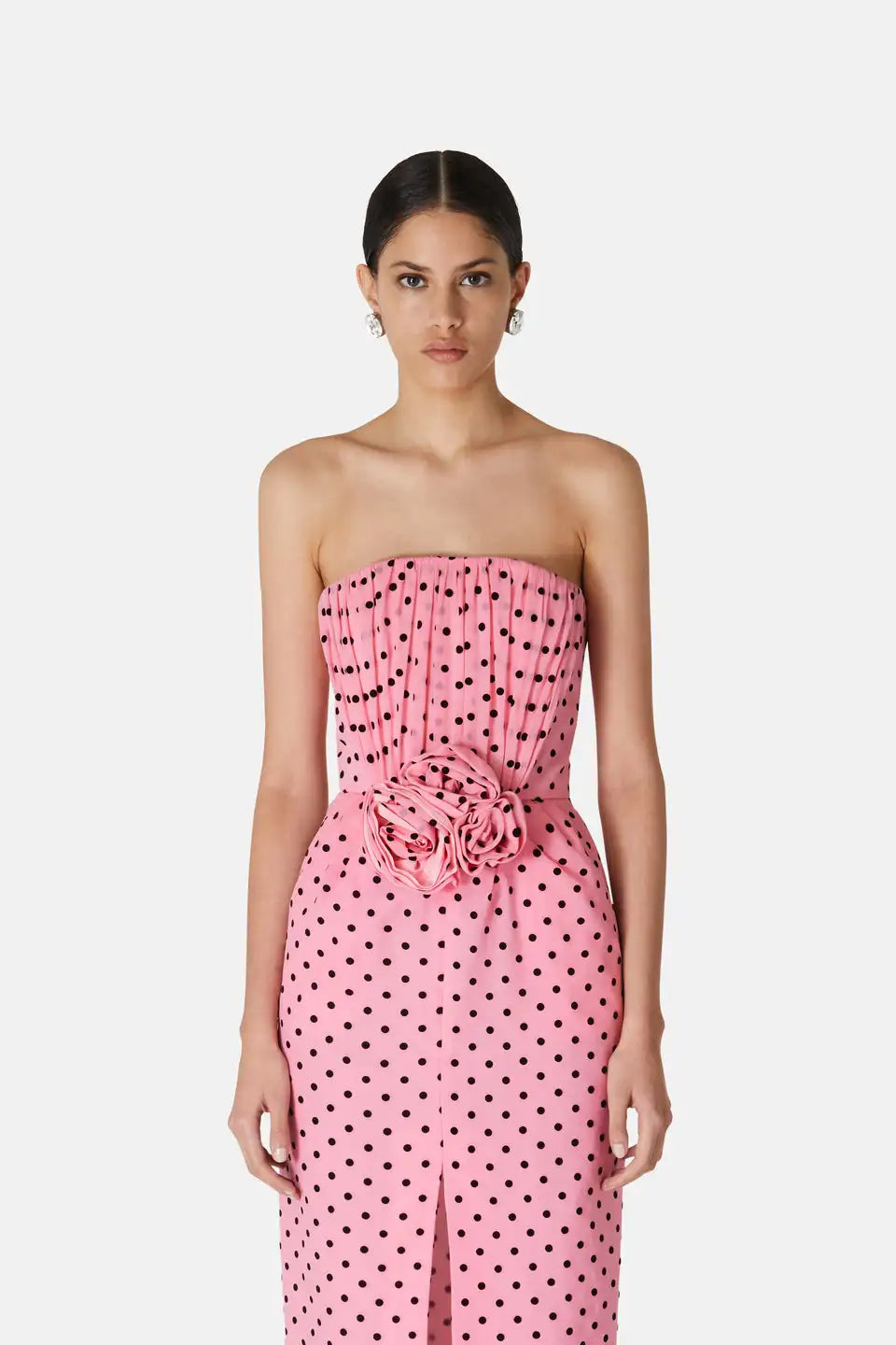 Introducing the Flocked Polka Dot Silk Georgette Dress by Alessandra Rich. Made with luxurious silk georgette fabric and adorned with delicate flocked polka dots, this dress exudes elegance and sophistication. Perfect for any special occasion, this dress is a must-have for any fashion-forward individual looking to make a statement.