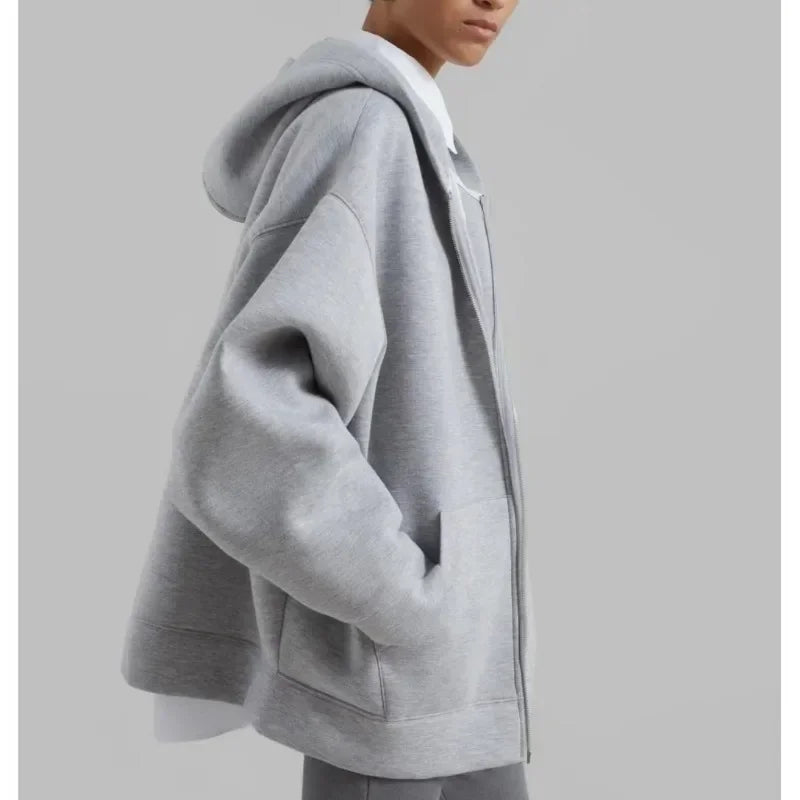 Indulge in luxurious comfort with the Denton Oversized Hoodie. Crafted from a midweight cotton blend, this hoodie boasts an oversized silhouette, exaggerated hood, and drop shoulders for a relaxed yet stylish look. Complete with large front pockets and a two-way zip closure, this unlined hoodie is perfect for chilly days.