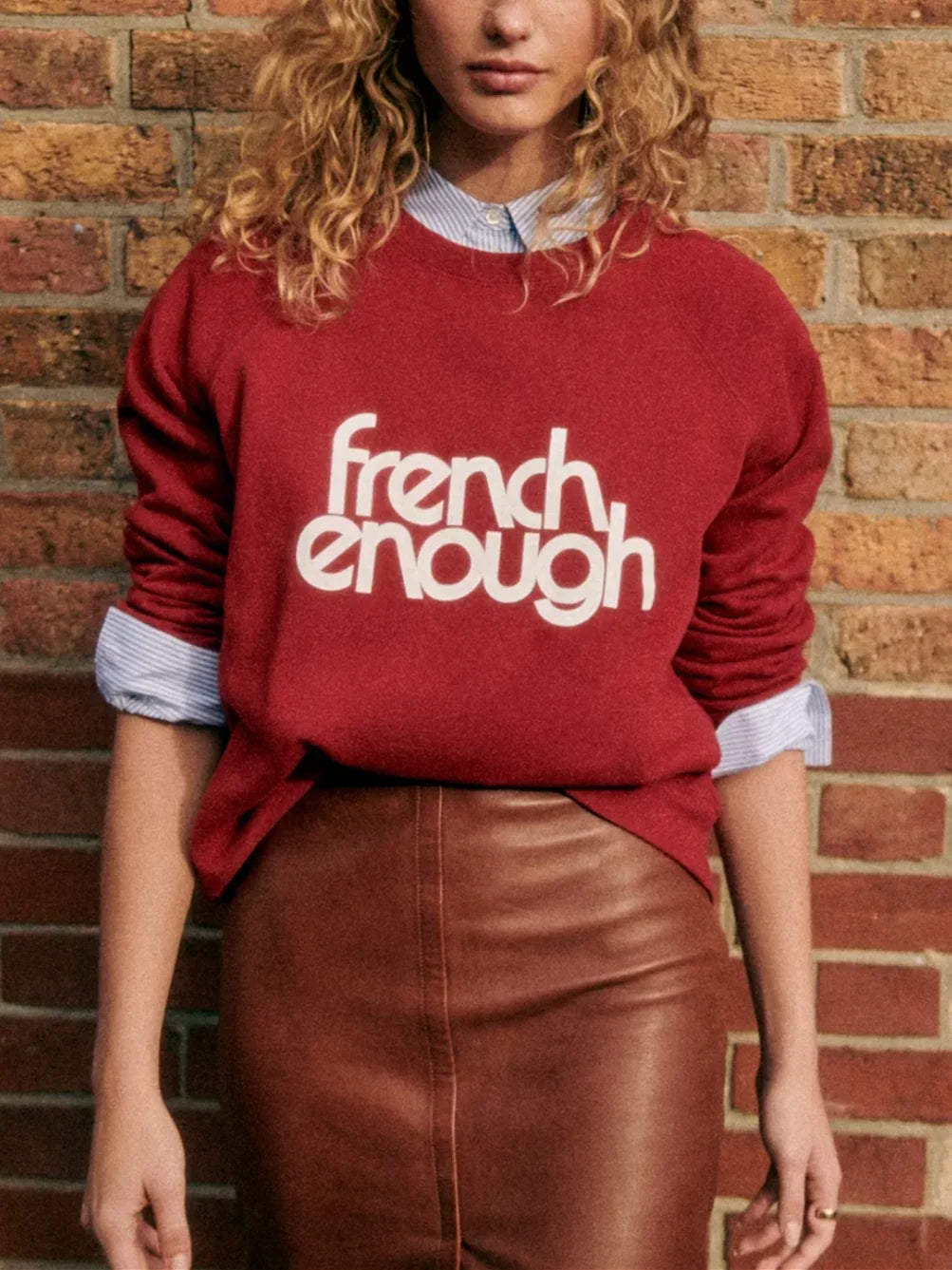 Stay comfy and stylish with this long-sleeved organic cotton sweatshirt. Show off your love for French culture with the "French Enough" print on the front, while staying cozy with the round neckline. Good for you and the environment.