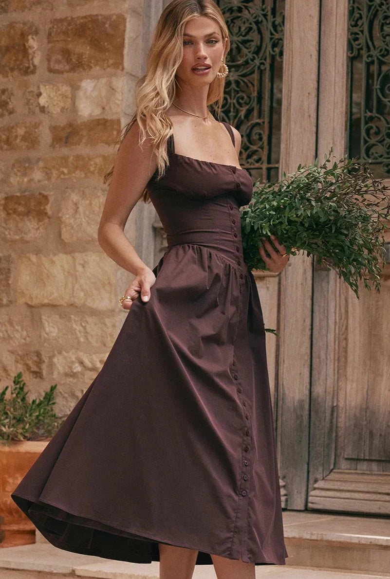 Experience the height of fashion with Dress Tatiana! This stunning midi dress features a spaghetti strap design and a beautiful brown color that will surely turn heads. Its flowing silhouette adds elegance to any outfit, making it perfect for any occasion. Be a trendsetter with Dress Tatiana!