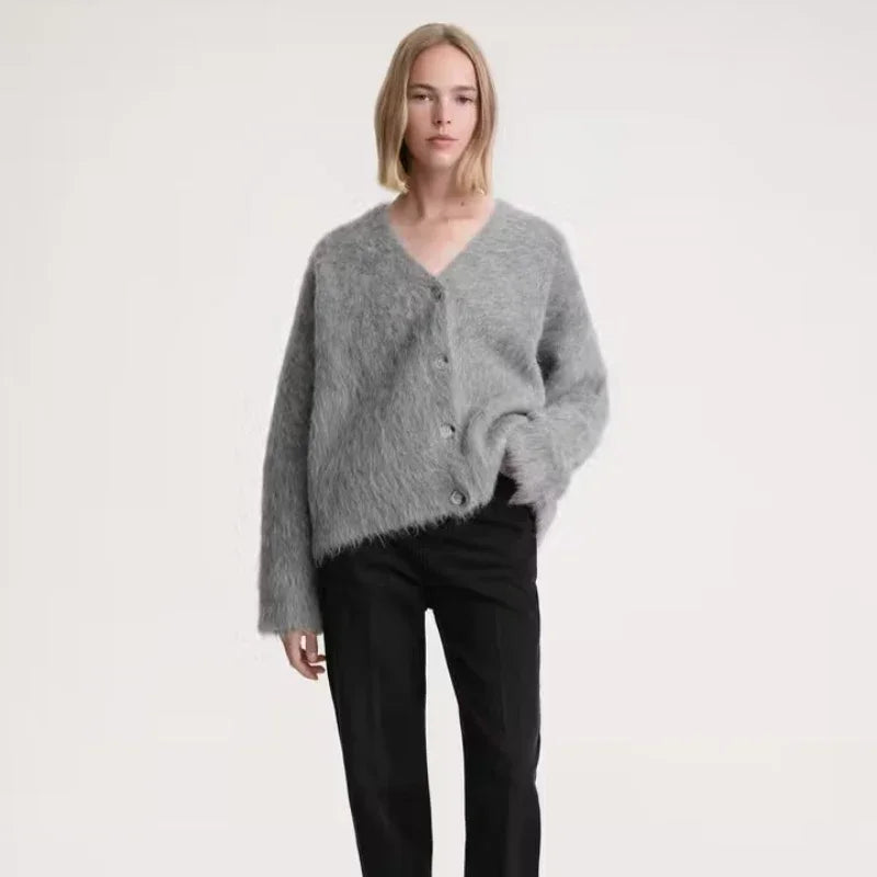 Introducing the 2024 Women Early Spring New Solid Color Alpaca Cardigan! Made with Totême design, this boxy alpaca cardi in grey melange will effortlessly elevate any outfit. Stay warm and stylish this season with our high-quality and unique piece.