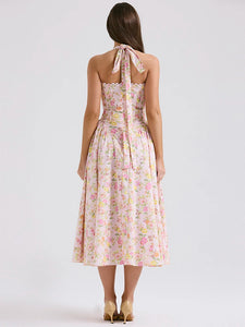 Adabella midi sundress is printed with colourful meadow flowers in full bloom that has us dreaming of Spring sunshine and balmy Summer days. Cut from a stretch cotton-rich fabric, it has a prettily gathered bustier neckline with wide self tie halter straps and a flattering fitted bodice. The voluminous midi skirt has a gorgeous floaty feel that's filled with soft tulle to hold the feminine shape beautifully. It zips to the back for easy on and is of course fully lined for comfort.