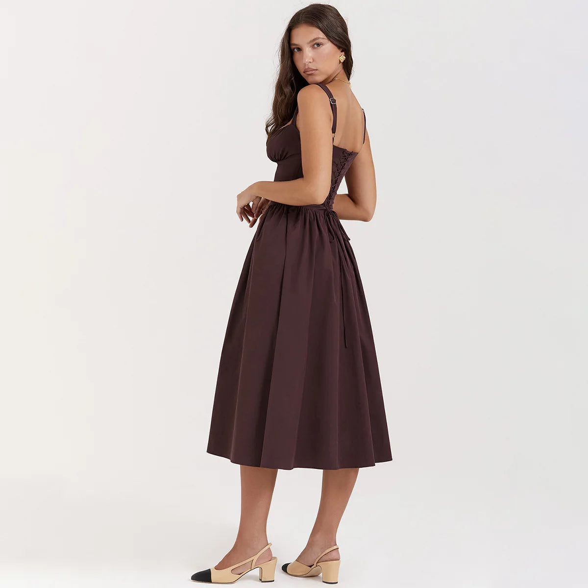 Experience the height of fashion with Dress Tatiana! This stunning midi dress features a spaghetti strap design and a beautiful brown color that will surely turn heads. Its flowing silhouette adds elegance to any outfit, making it perfect for any occasion. Be a trendsetter with Dress Tatiana!