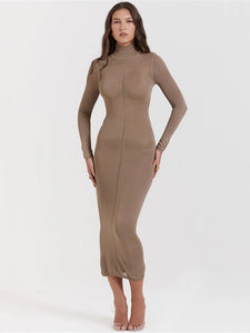 Introducing the Dress Nissa, the perfect combination of style and comfort. This turtleneck bodycon midi dress is designed with a sleek backless feature, making it a trendy addition to your wardrobe. Made for women, this dress offers a form-fitting look that flatters any figure. Get ready to turn heads at any occasion.