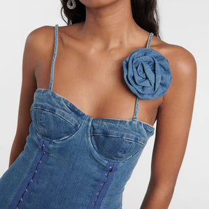 This vintage washed denim dress features a three-dimensional floral embellishment, adding a touch of femininity to the overall design. Made with high-quality cotton fabric, this dress offers both style and comfort. Perfect for any occasion, this stretchy mini dress is a must-have addition to your wardrobe.