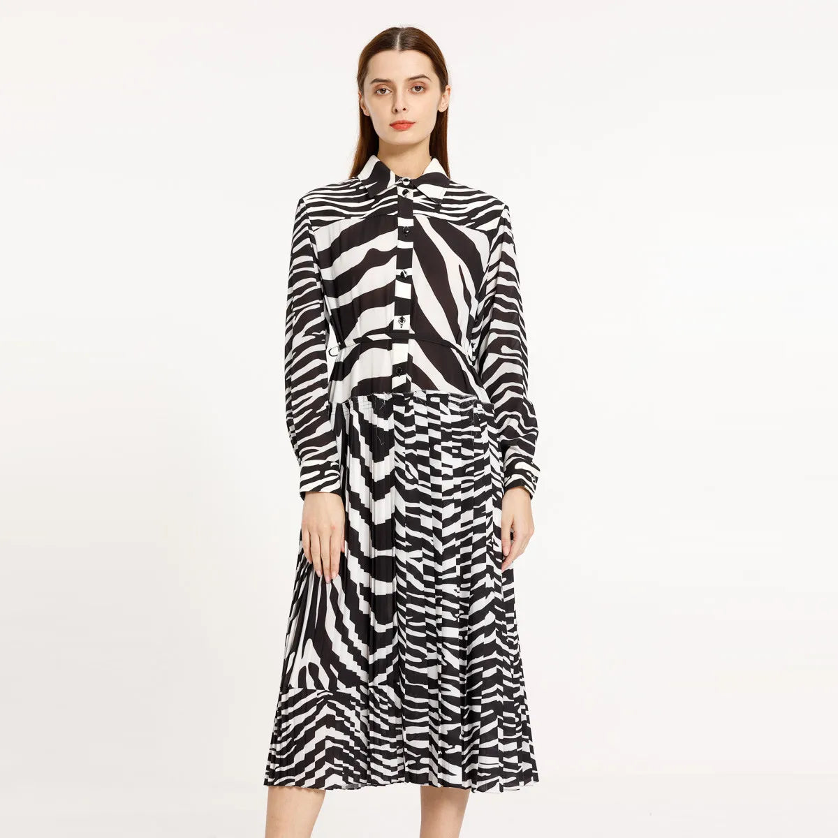 Elevate your style with our Poplin Chemisier Dress. This midi dress features a unique zebra pattern and pleated design, adding a touch of sophistication to your wardrobe. Perfect for any occasion, this dress is sure to make a statement.