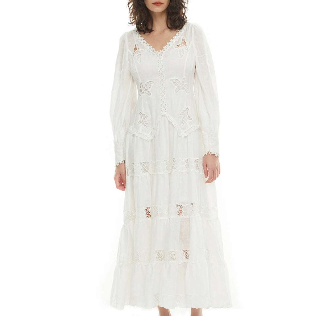 Introducing the Dress Giselle - a stunning and versatile piece for any occasion. With its V-neck design, airy linen fabric, and elegant lantern sleeves, this dress will keep you comfortable and stylish all day long. The beautiful embroidered details add a touch of femininity and charm. Upgrade your wardrobe with Dress Giselle today.