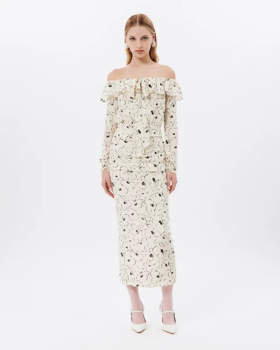 Expertly designed by ALESSANDRA RICH, this off-shoulder silk midi dress showcases a beautiful floral pattern. Exuding elegance and femininity, the dress is perfect for any occasion. Crafted with high-quality silk, it offers both style and comfort, making it a must-have in every wardrobe.